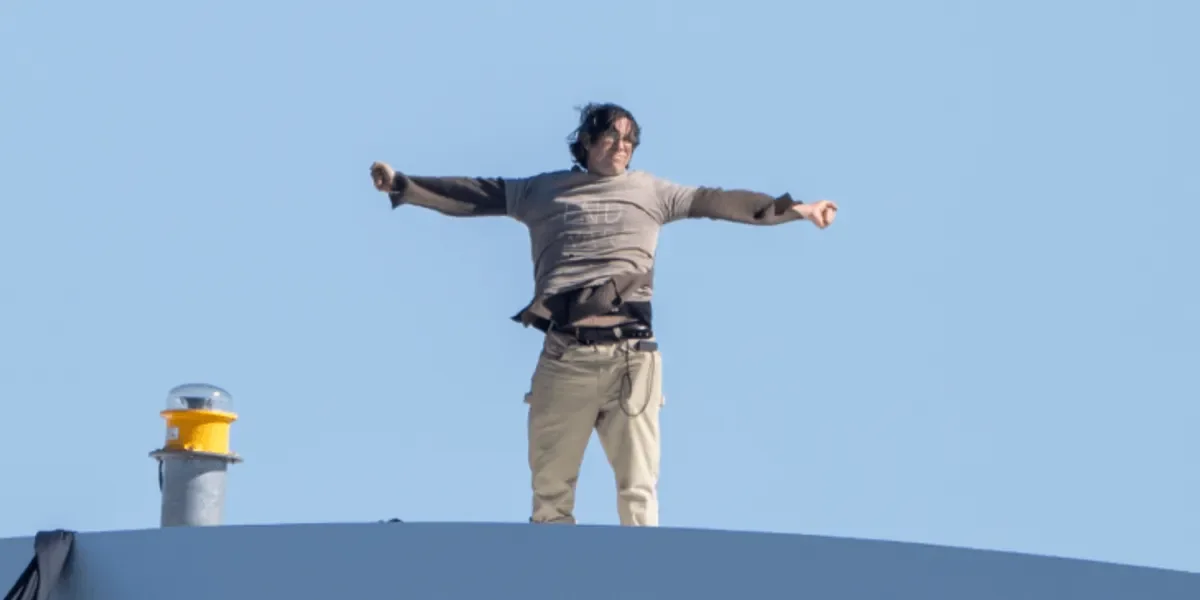 DC Bridge Stand: Activist Scales 168 Feet to Demand End to Iran War and AI Threat