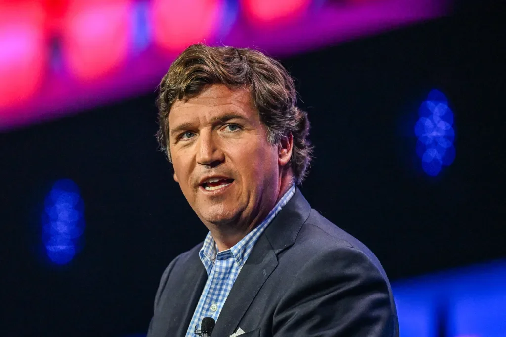 Carlson apologizes for backing Trump, says the stance will haunt him