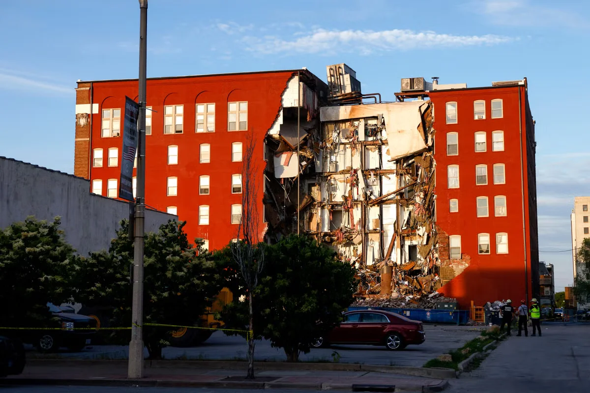 Davenport building collapse leaves survivor with lost leg and two feared trapped.
