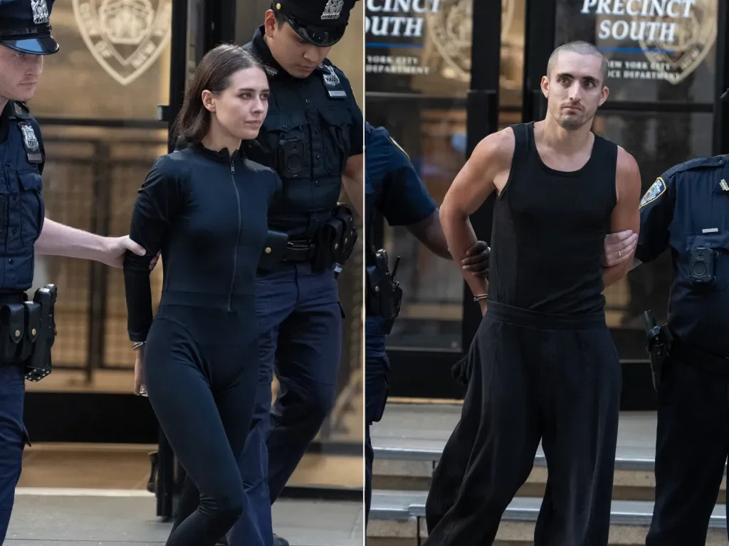 Daredevil duo Nikolau and Beerkus scale the Empire State Building for peace banner