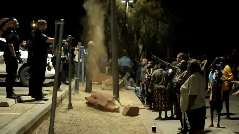 Outback mockery of justice: vigilante clashes erupt as alleged child killer is arrested in Alice Springs
