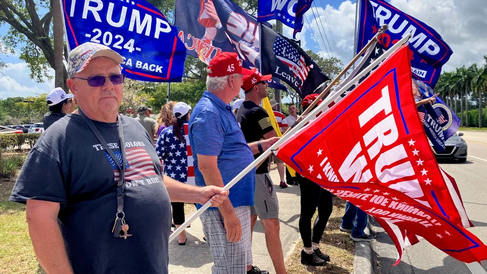 Trump supporters rally outside golf course amid indictment and arraignment.