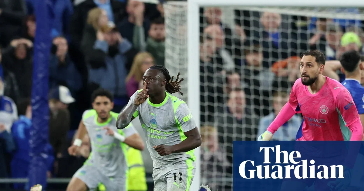 Doku’s stoppage-time stunner keeps City level with Everton, heightening Arsenal’s title pressure