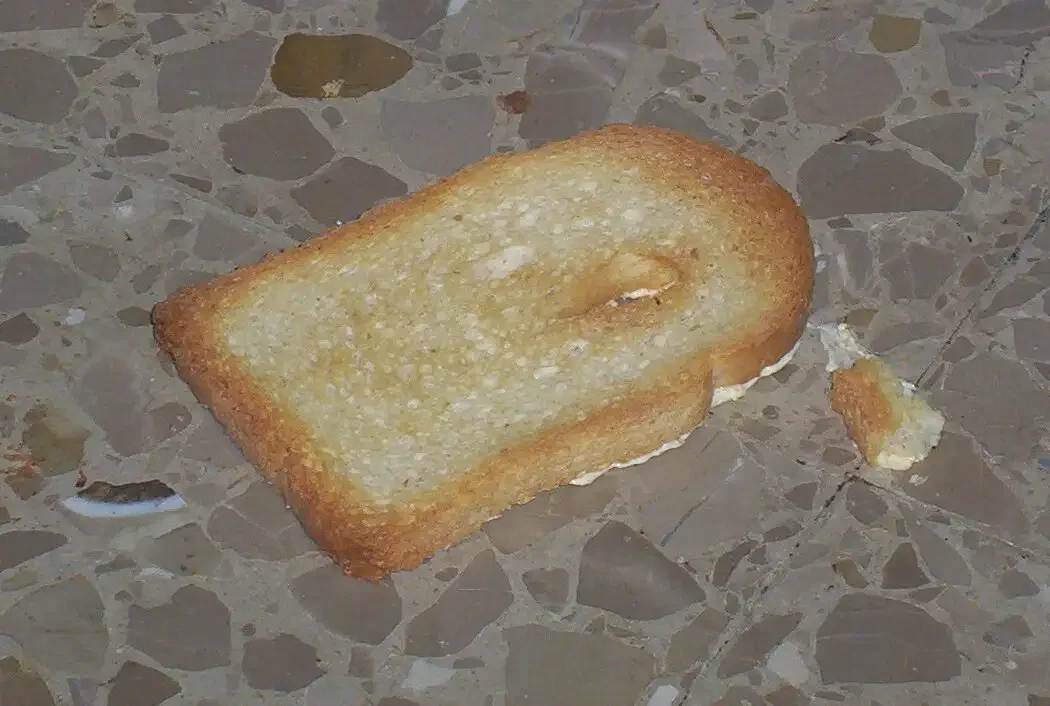 Half-Turn Physics: Why Buttered Toast Lands Butter-Side Down