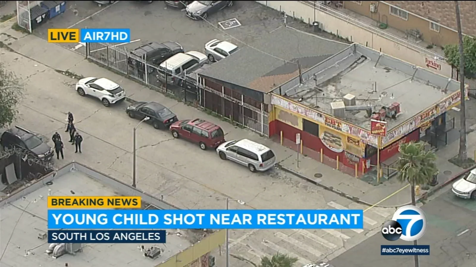 Police search for 2 suspects after toddler shot near burger joint in South LA.