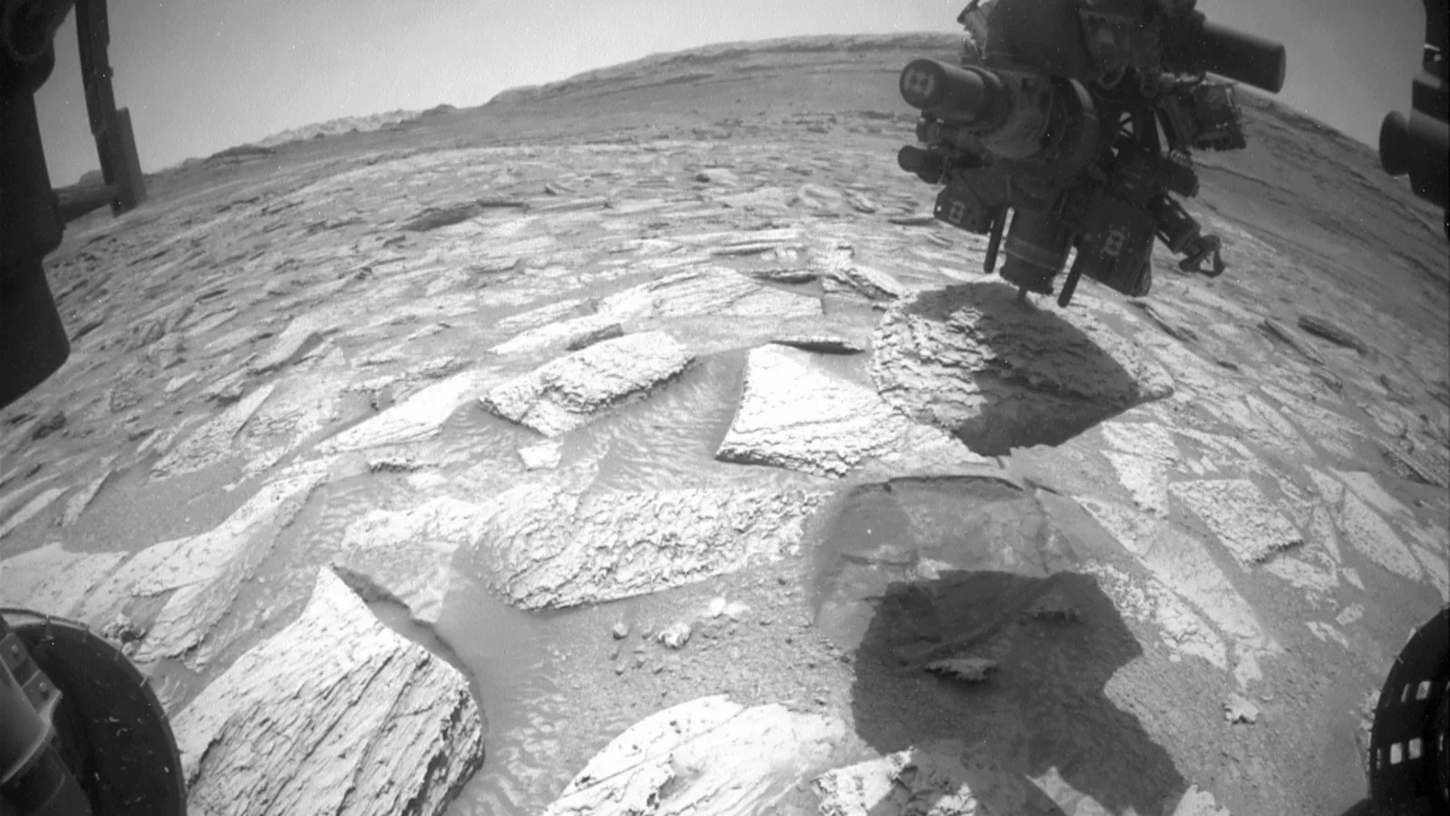 Martian rock clings to Curiosity for six days before release