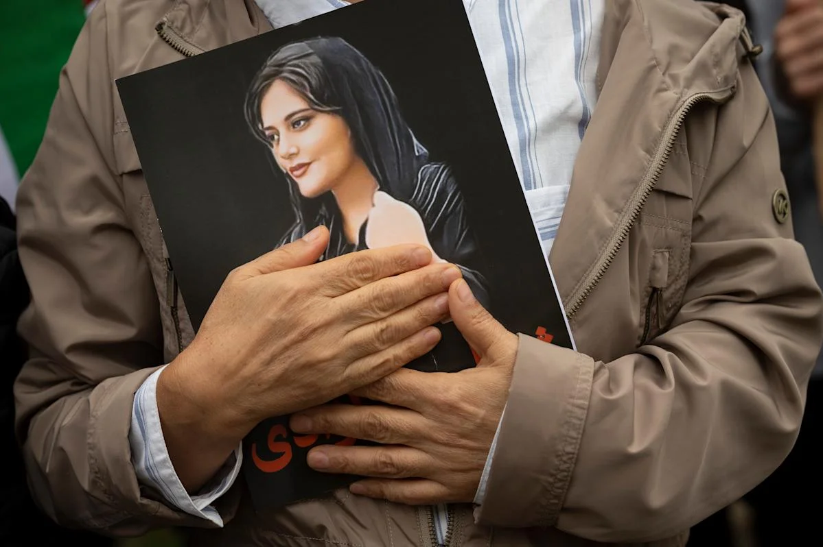 Swiss envoy summoned by Iran over Twitter post featuring Mahsa Amini.