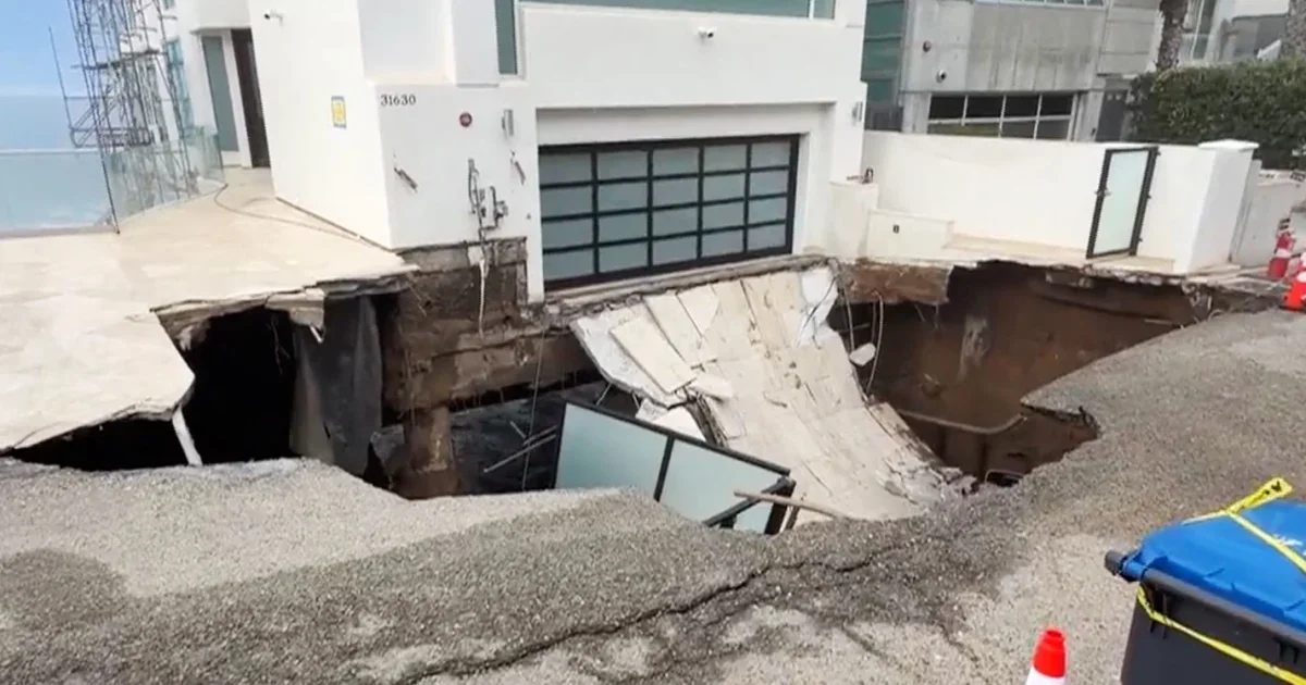 Malibu driveway collapses under pounding surf as coast erodes