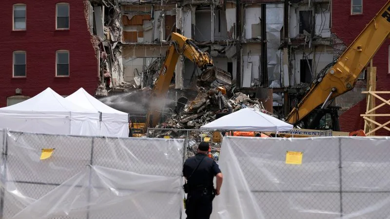 Survivor sues over Iowa building collapse, while search and rescue teams return home.