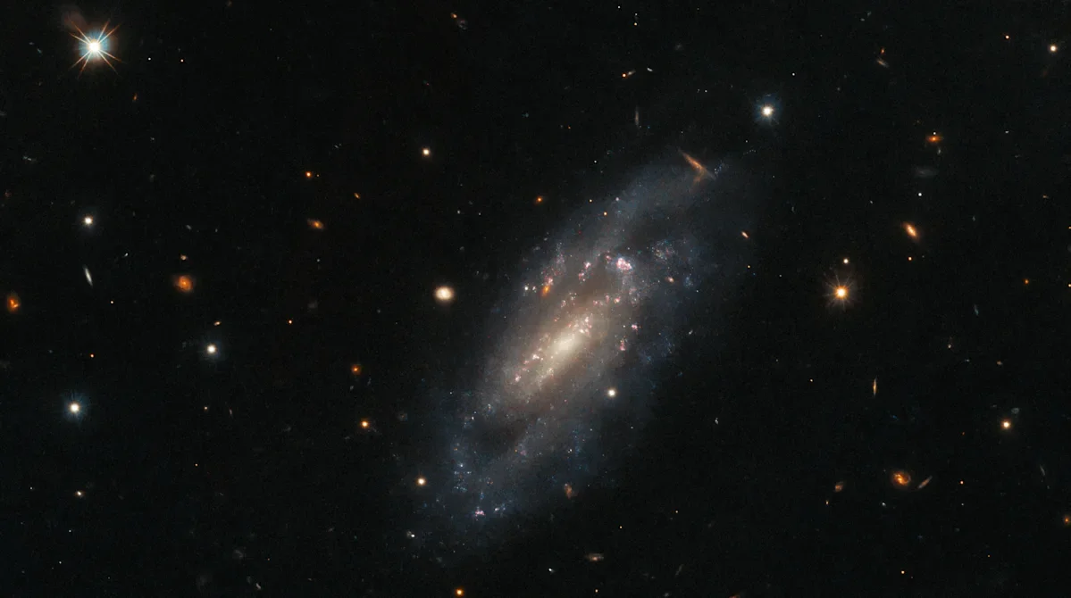 "Jaw-dropping Photo: Hubble Telescope Captures Spiral Galaxy in All Its Glory"