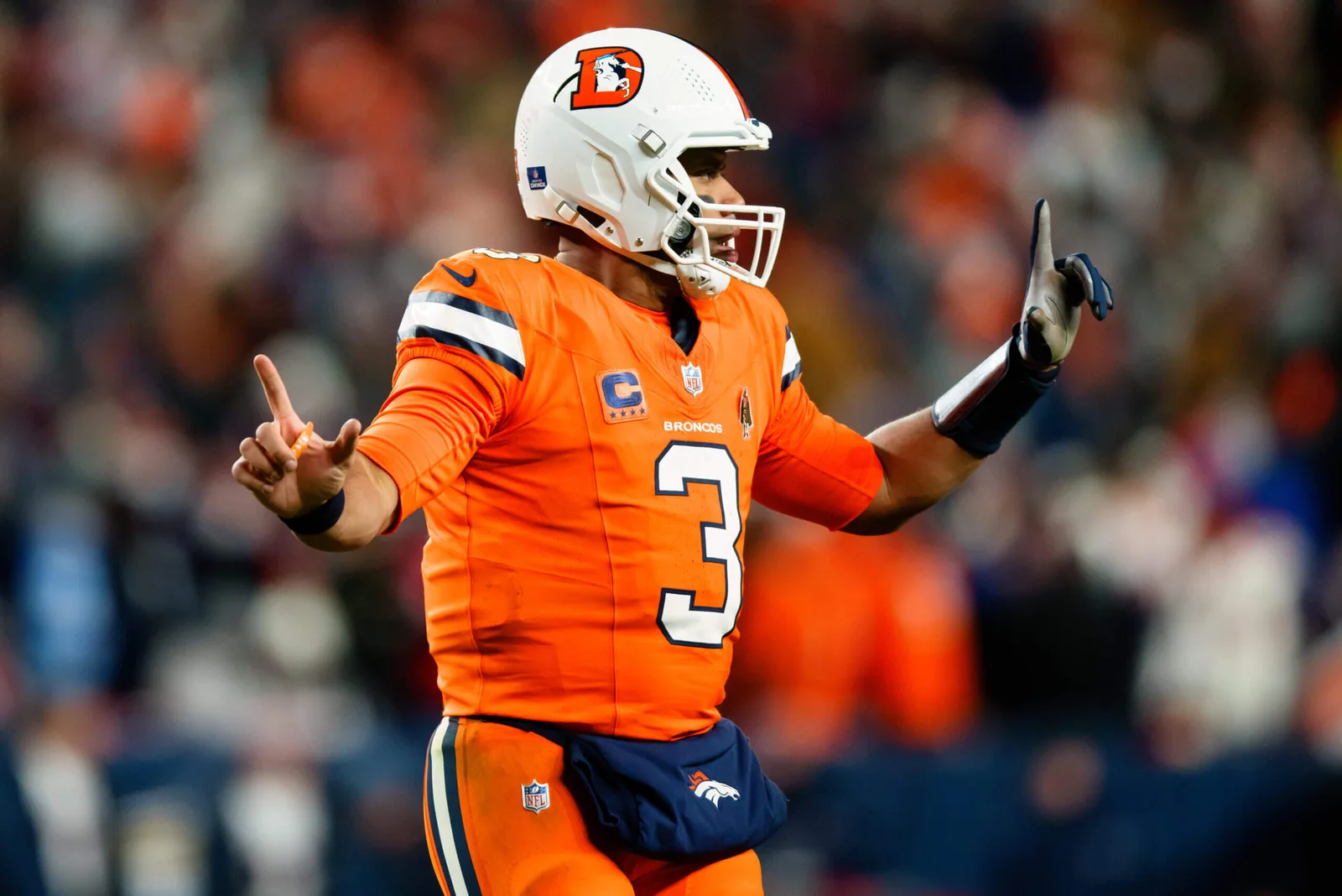 "Turmoil in Denver: Wilson's Bench Warning, Contract Dispute, and Broncos' Free Agent Dilemma"