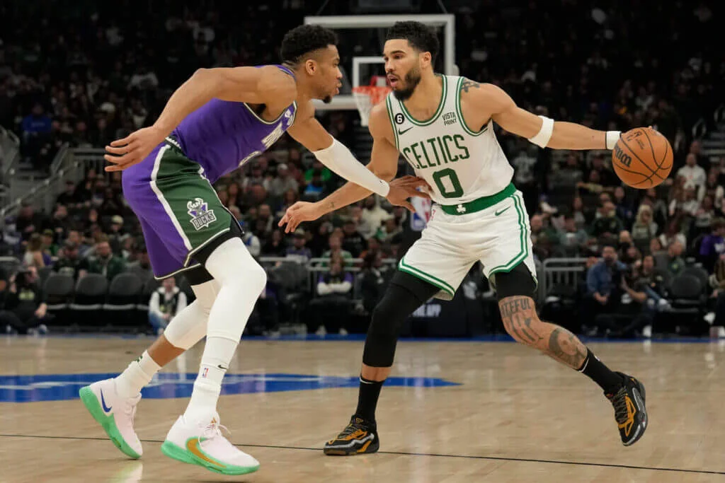 "Celtics Dominate Bucks in Playoff Race"