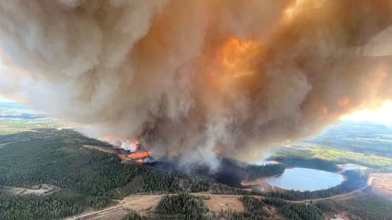 Wildfires force mass evacuations across Western Canada.