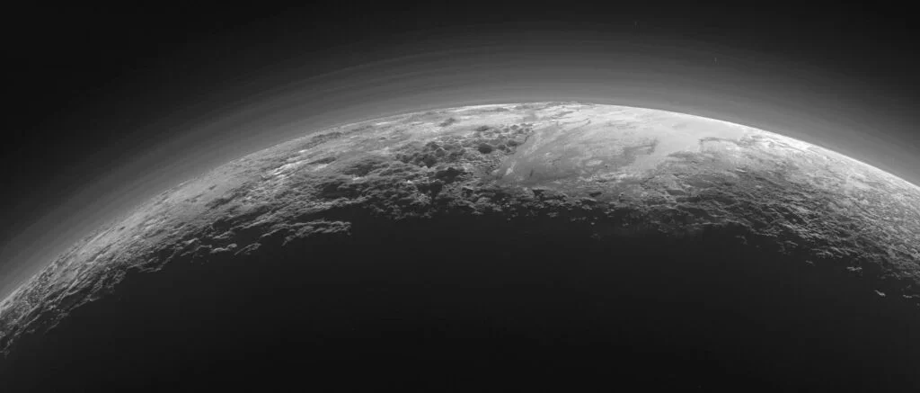Pluto Revealed as a Dynamic World of Ice Flows and Blue Haze