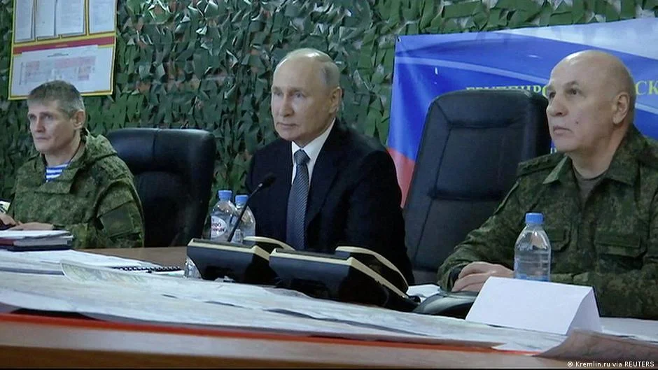 Putin's surprise visit to Ukraine's war-torn regions.