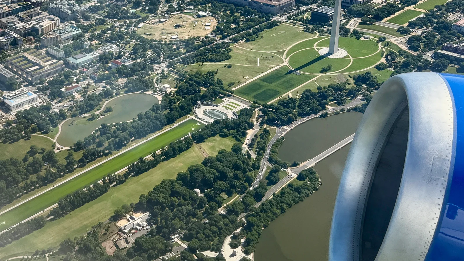 Algae-green Reflecting Pool and White House lawn under repair in DC, seen from the air