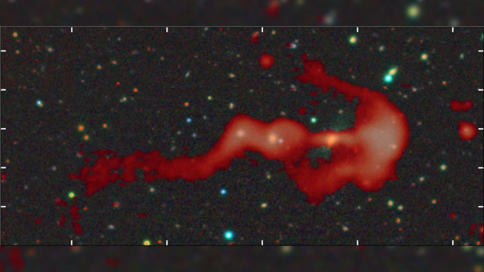 Giant bow-and-arrow radio galaxy RAD-BAARG reveals colossal cluster shock wave