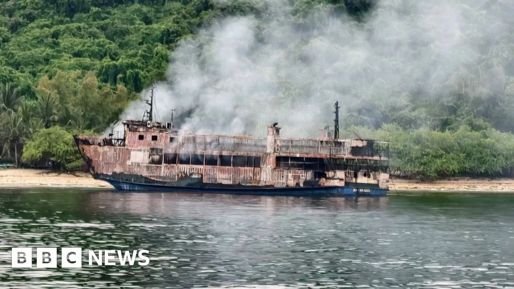 Rescuers board burning Philippine ferry as search for missing continues