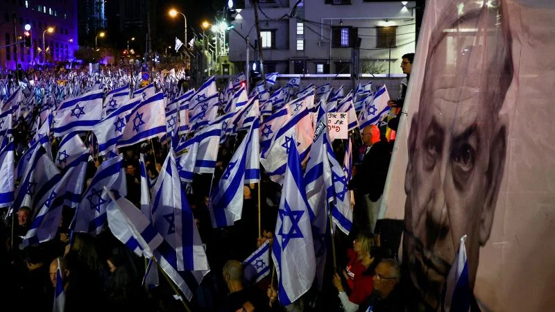 Israel's Netanyahu government backtracks on controversial judicial overhaul plan.