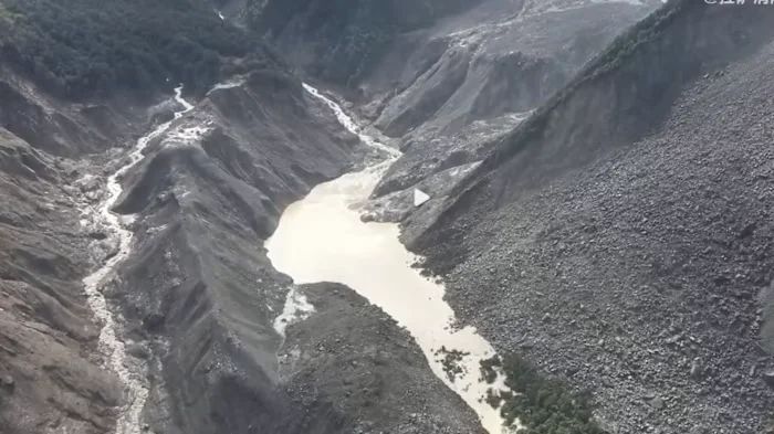 Overflowing barrier lake halts Himalayan flood rescue on China-Nepal border