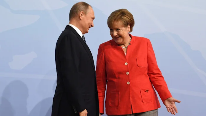 EU eyes Merkel or Draghi as Europe's Putin envoy