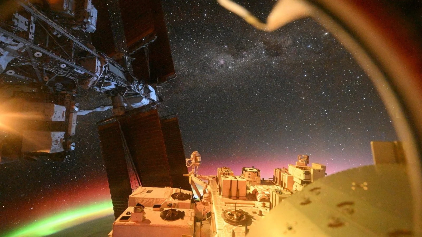 Aurora over Earth and Alpha Centauri: rare ISS vantage point