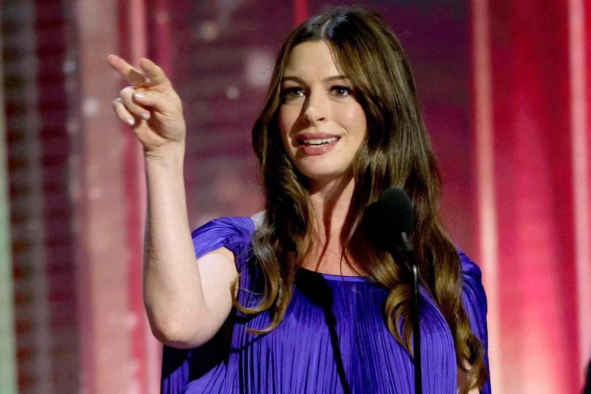 Anne Hathaway Stuns in Purple Cape Gown While Pregnant at Disney Legends Awards 2026