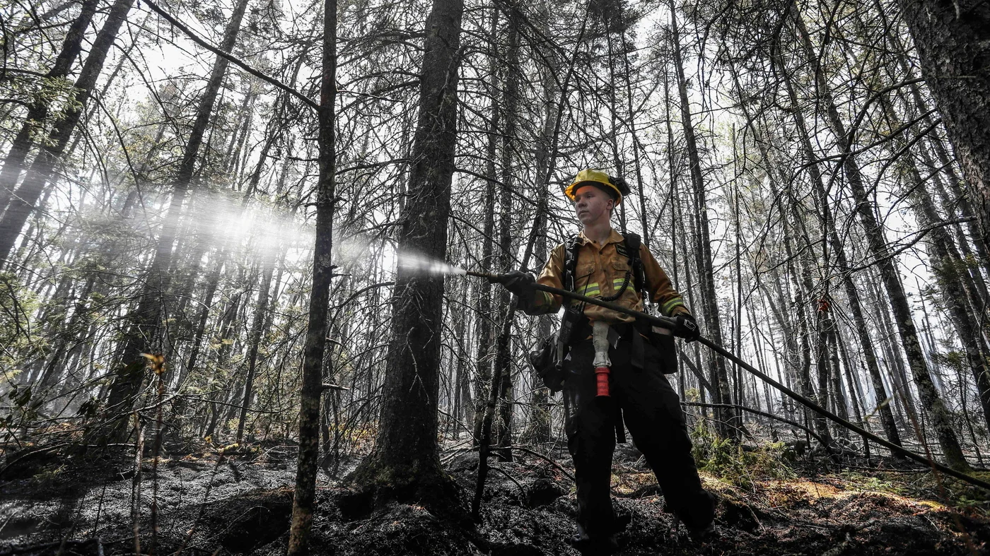 Rain helps contain Nova Scotia wildfires, but smoke still poses air quality concerns.