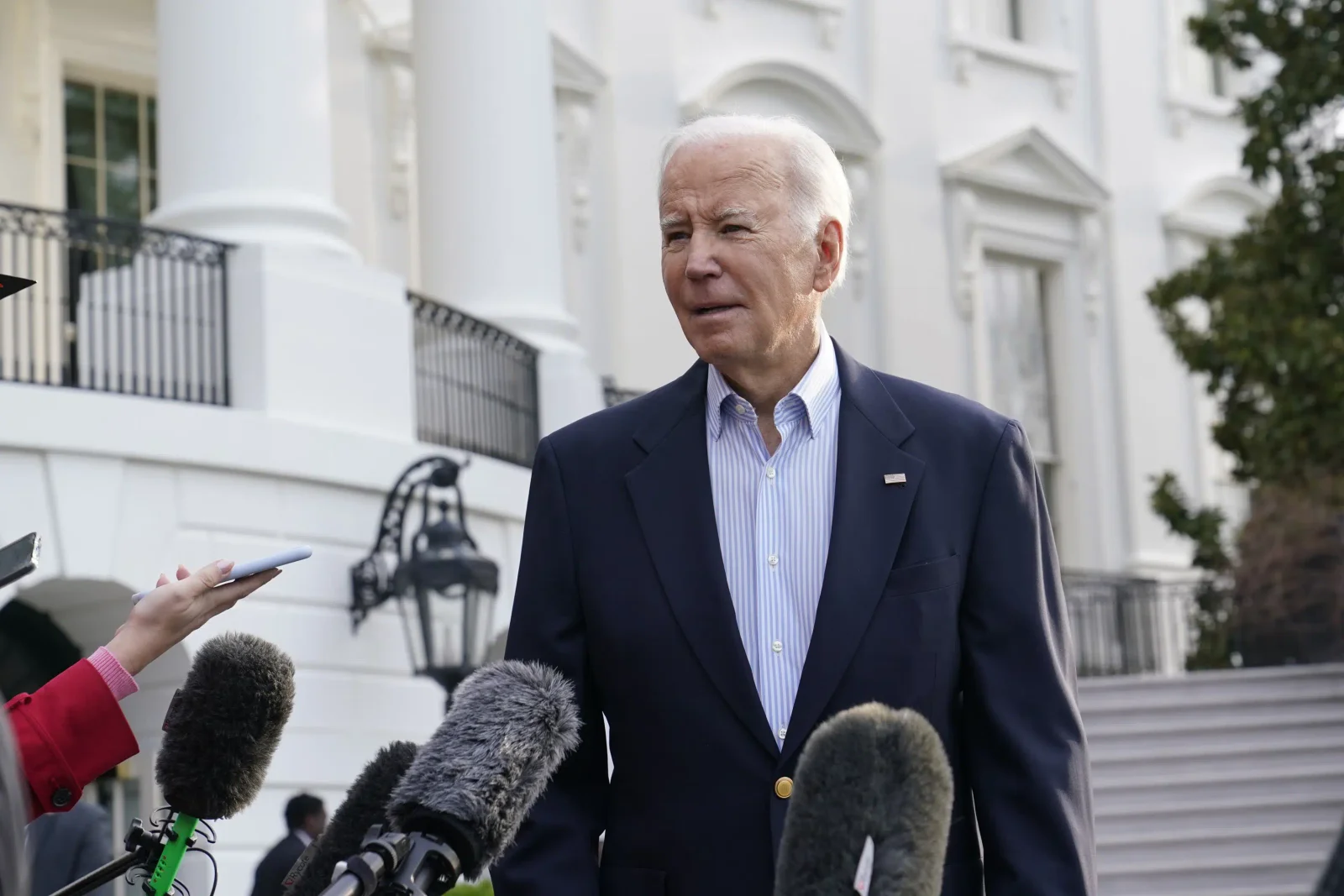 Biden urges Russia to release detained US journalist.