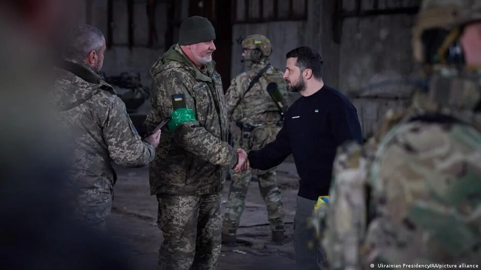 Zelenskyy visits troops near Bakhmut as IMF approves $15.6 billion loan to Ukraine.
