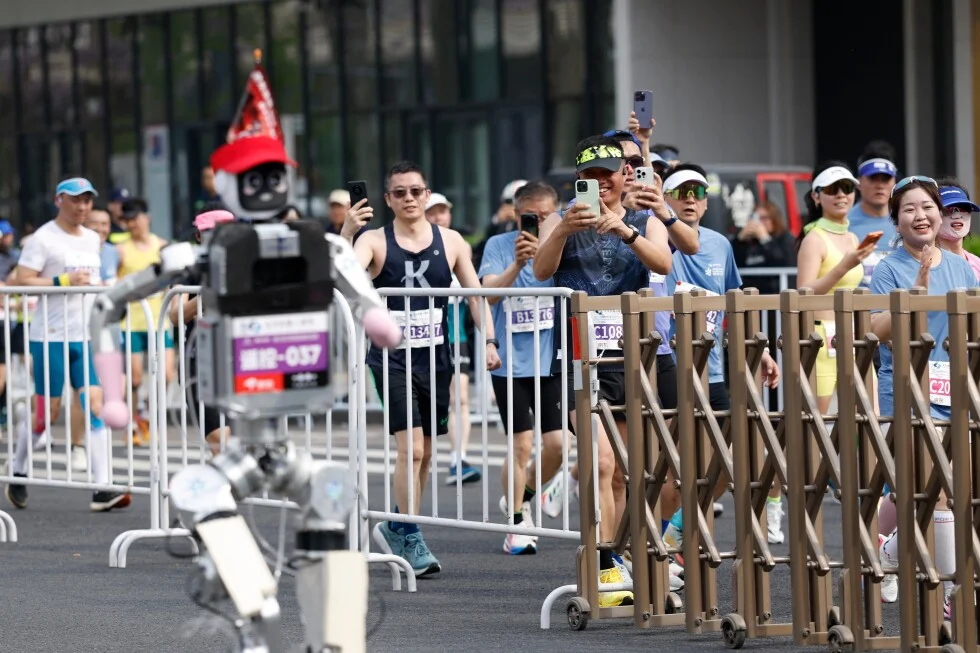 Humanoid robot edges past humans to claim half-marathon record in Beijing