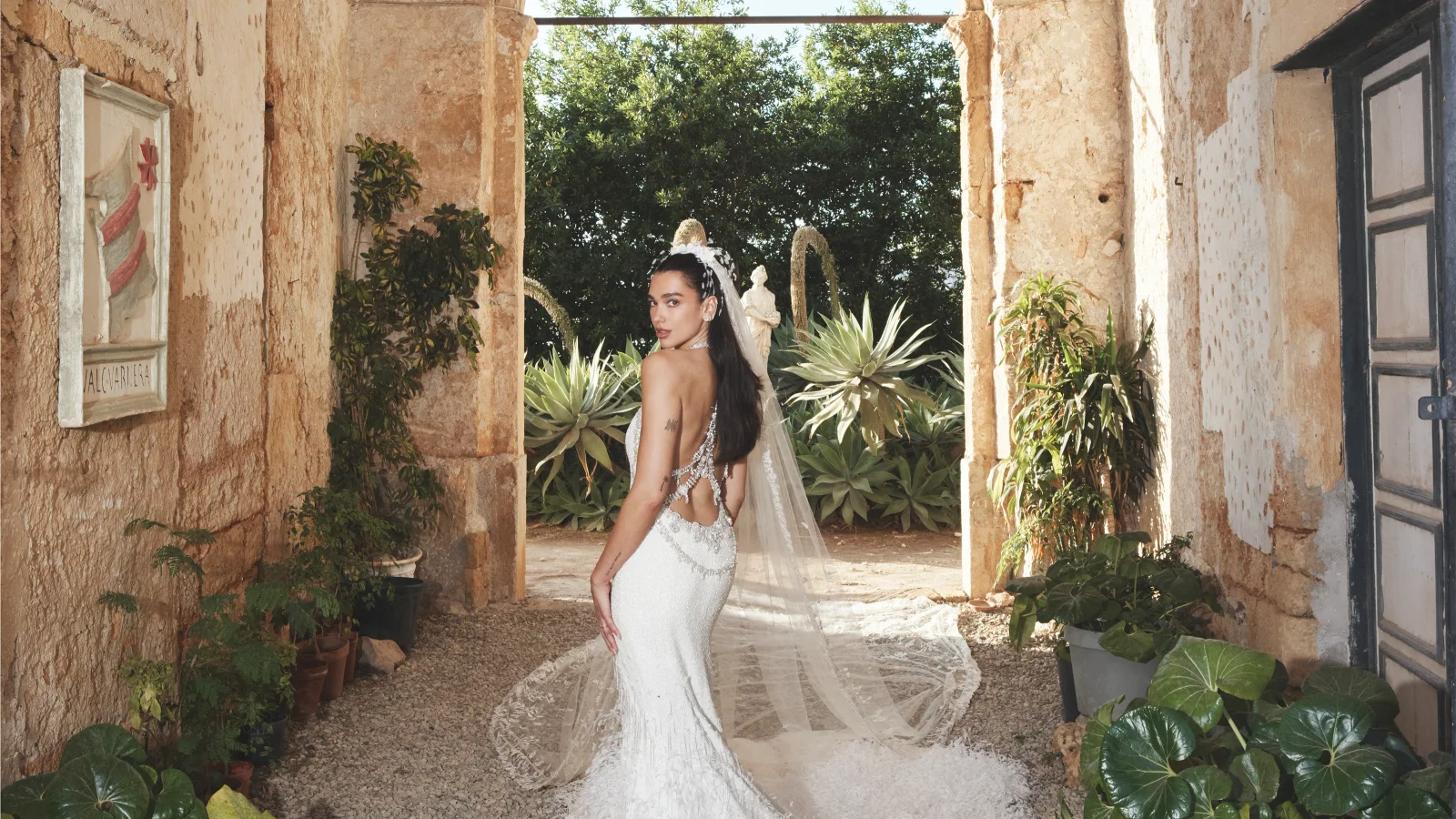 Dua Lipa Stuns in Feathered Chanel Gown for Sicily Wedding