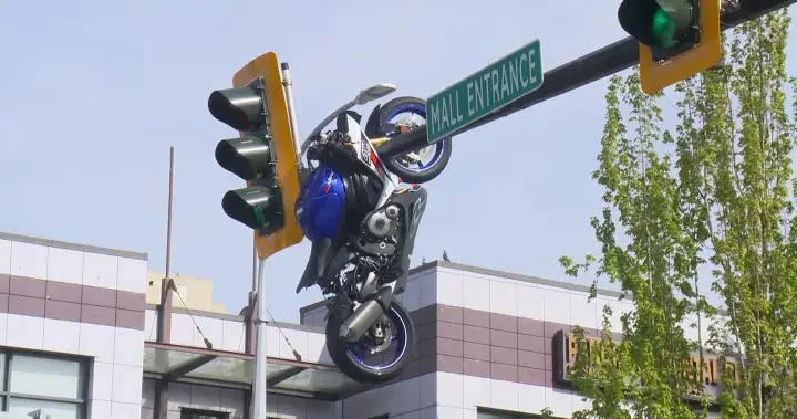 Motorcycle left hanging from Delta traffic light after Scott Road crash