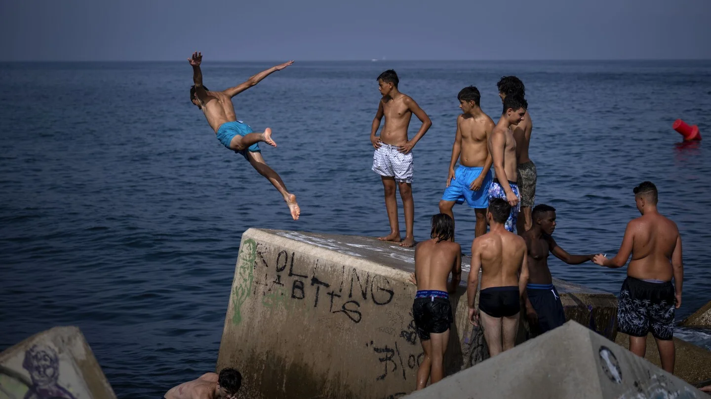 "Scorching Heatwave Grips Spain, Sweating Out Sultry Nights and Testing Holidaymakers"