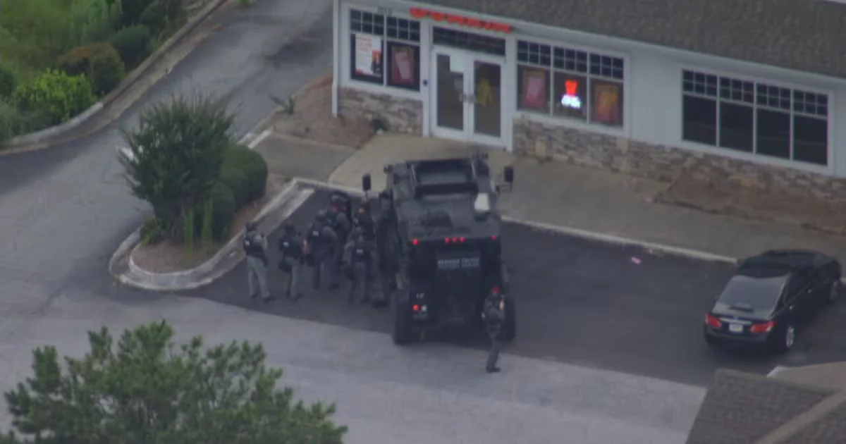 Stolen-car standoff ends with arrest at Newnan Dunkin’