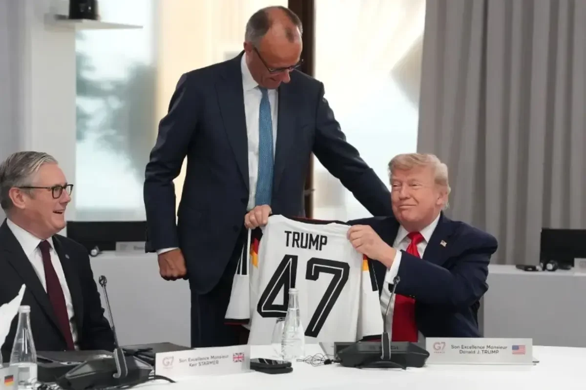 Merz gifts Trump a 'Trump 47' jersey at G7 in belated birthday gesture