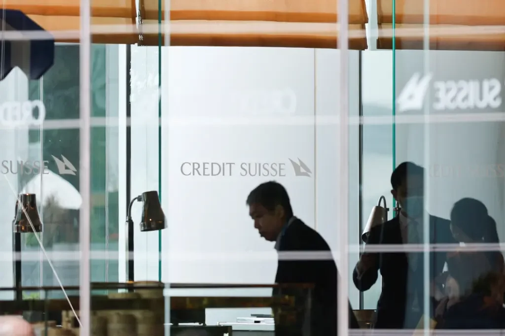 Credit Suisse's Rescue Sparks Layoffs and Online Sales of Gold Bars and Hats.