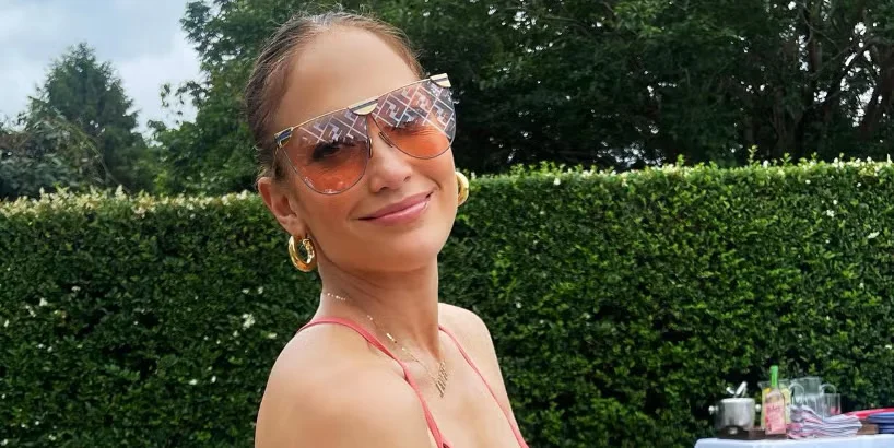 "Jennifer Lopez Sizzles in Coral Swimsuit with Daring Bust Cutouts for Fourth of July"