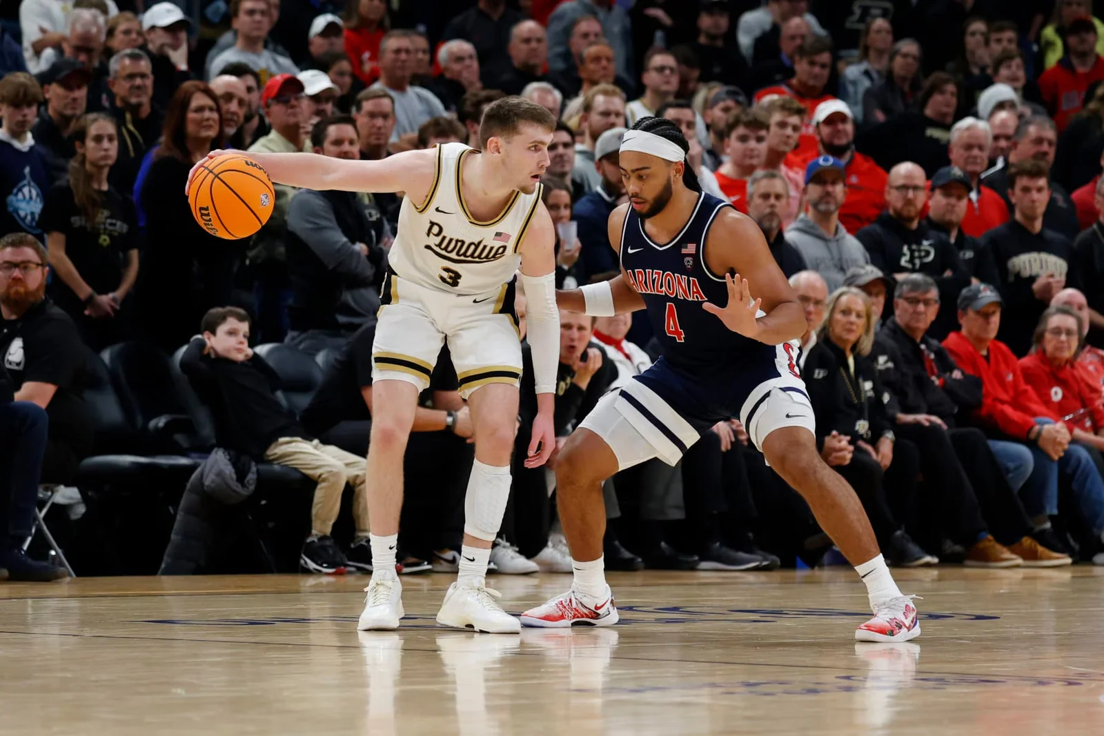 "Purdue Reclaims Top Spot in College Basketball Rankings"