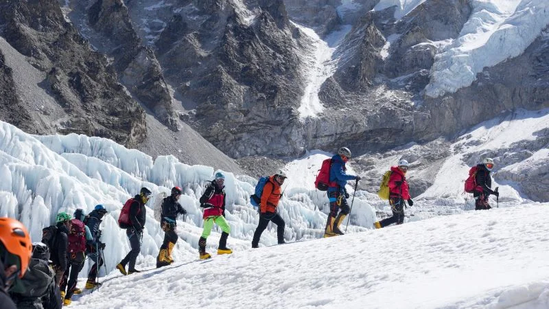Glacial block stalls Everest push as base camp braces for crowds