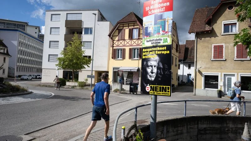 Switzerland votes on 10-million cap that could strain EU ties