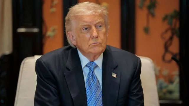 Trump’s Gold-Tone Phone Triggers Backlash Over Flag Flub