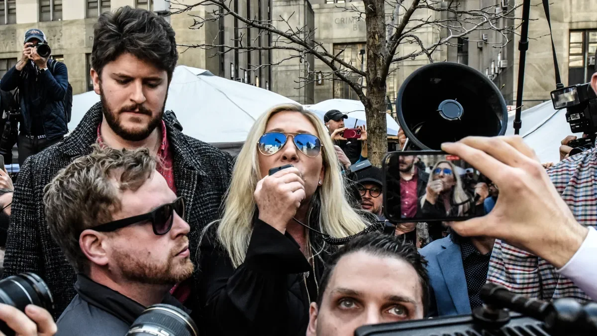 Marjorie Taylor Greene's Chaotic Presence at Trump Rally and Arraignment
