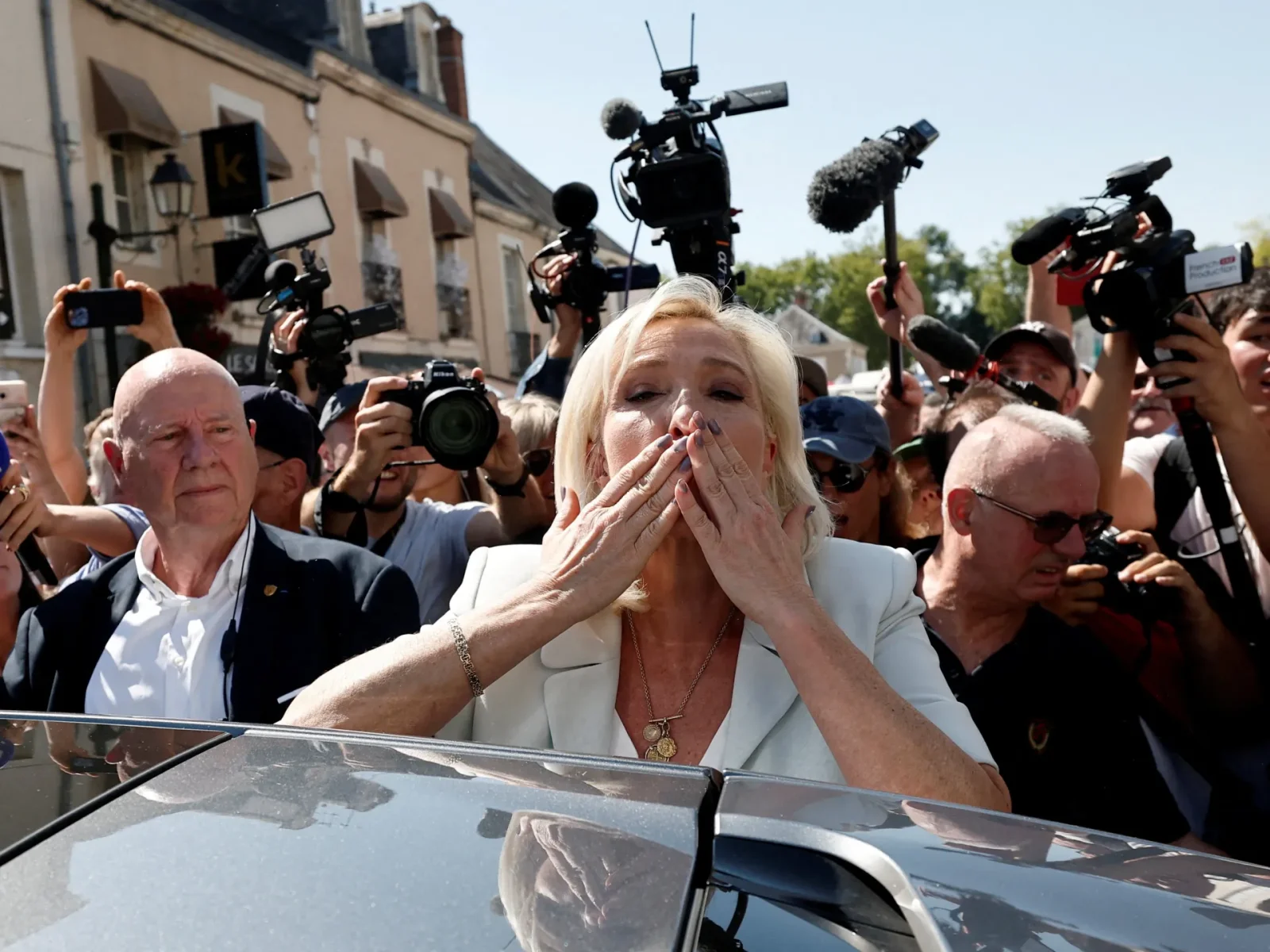 Le Pen presses ahead with 2027 bid, hinting at campaign under ankle monitor