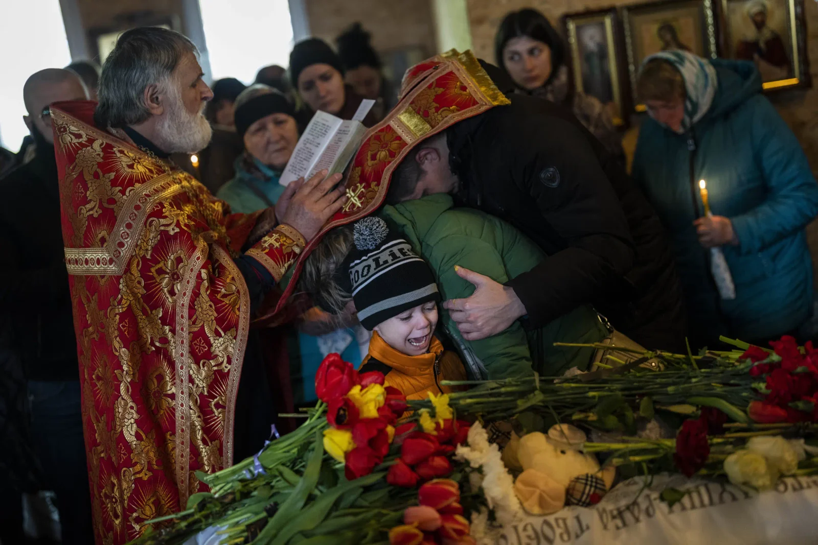 Grieving families lay to rest children lost in Russian missile strike.