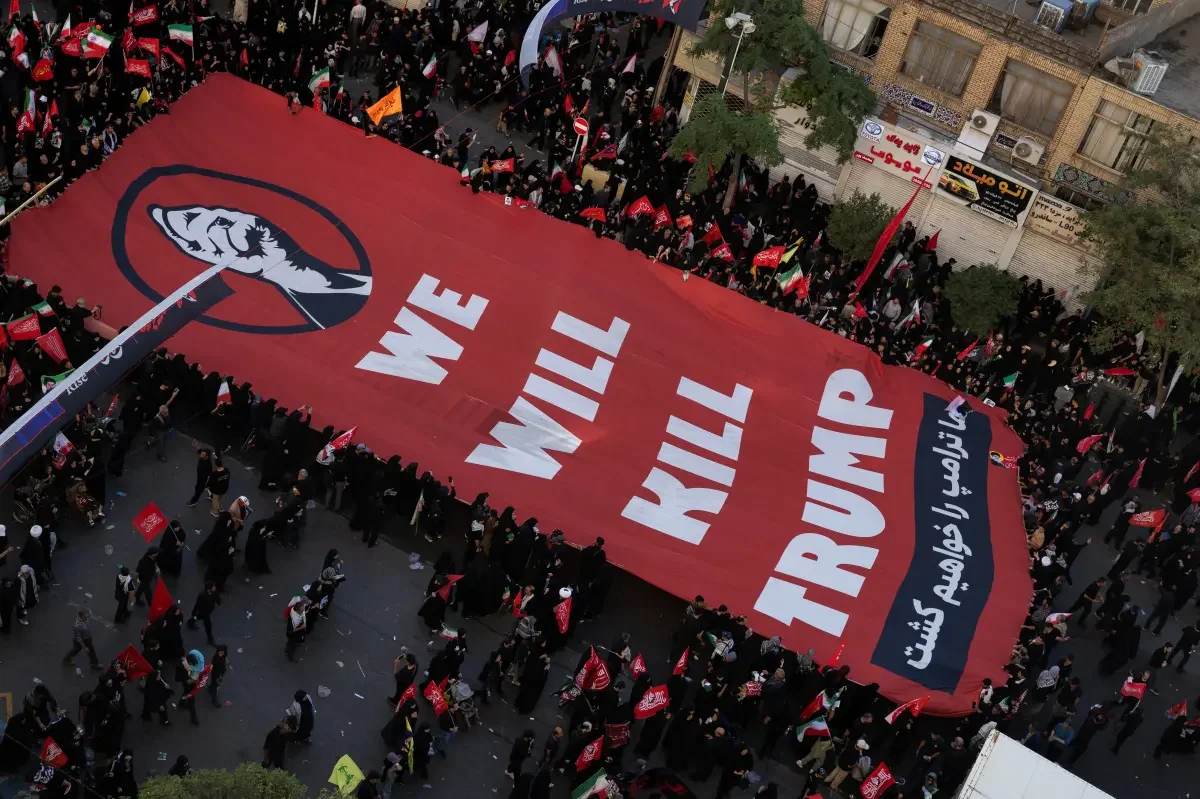 Iranian mourners brandish Trump assassination banners at Khamenei funeral