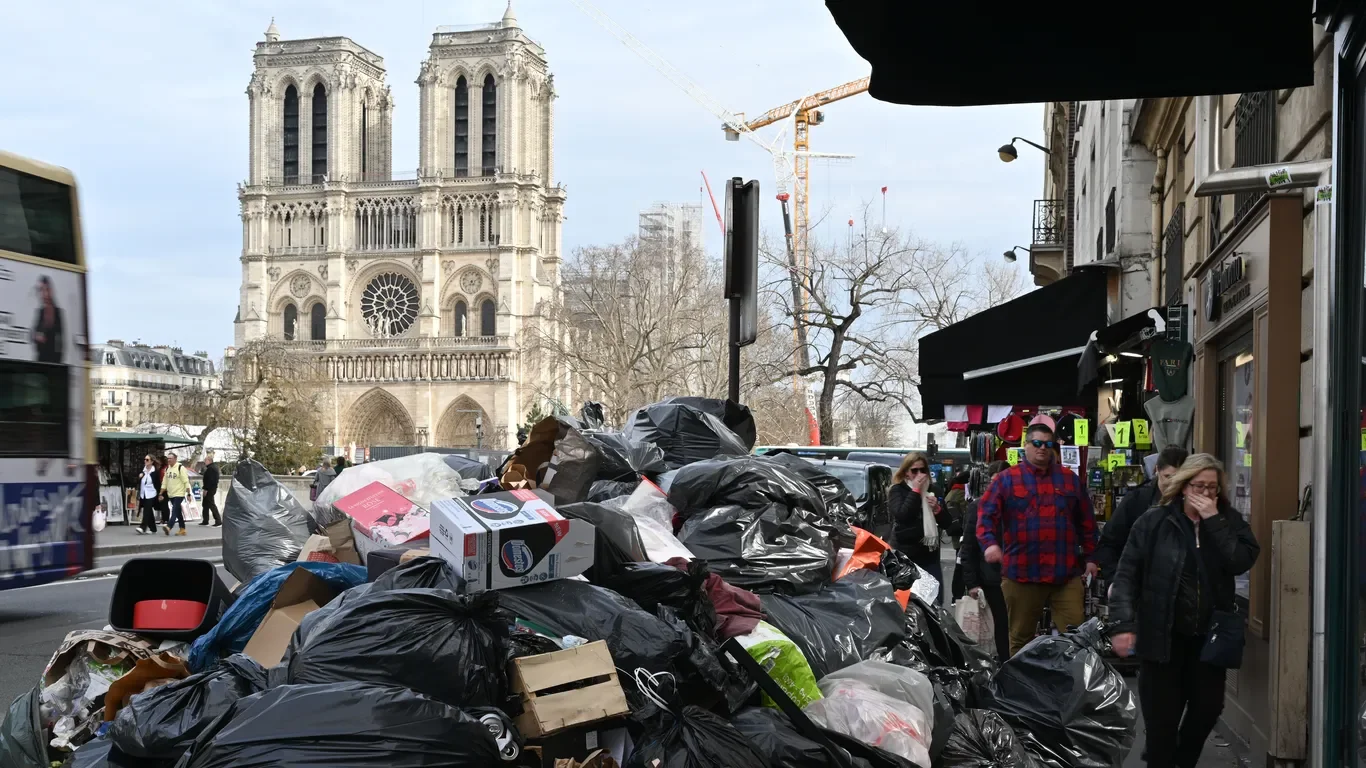 Parisian Garbage Piles Spark Protest Movement.