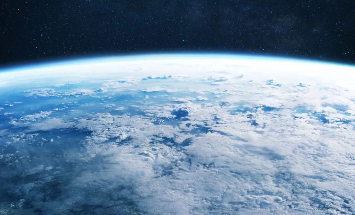 CO2's paradox: surface warming, stratospheric cooling explained