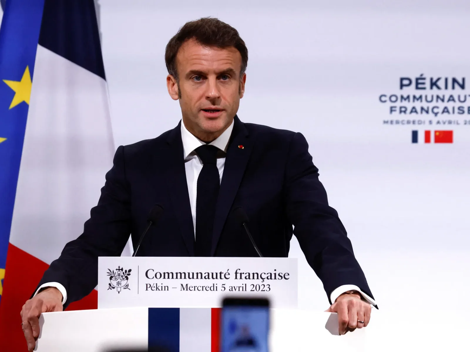 Macron faces protests in Netherlands and shifts stance on foreign relations.