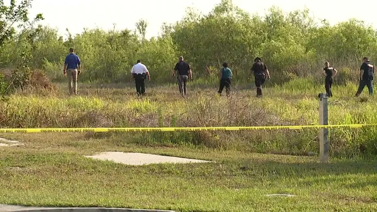 Police investigate after body found burning in Florida field.